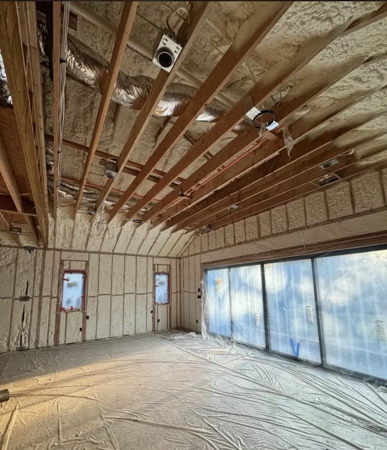 Interior walls and ceiling insulated with spray foam during new construction in Falmouth